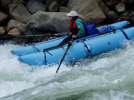 A person in a kayak in a river

Description automatically generated with low confidence